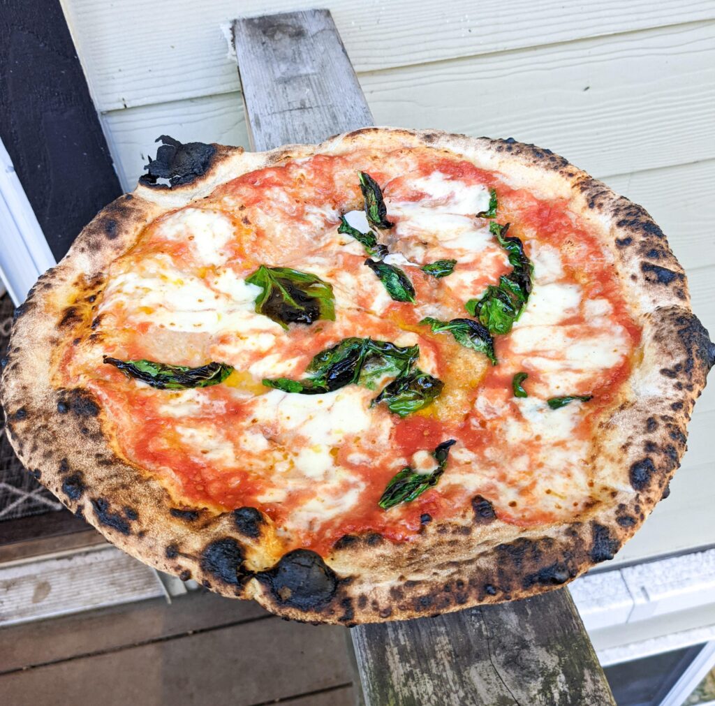 My attempt at making a Da Michele style Margherita in my backyard.