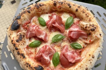 Pizza with tomato sauce, fresh mozzarella and aged Gouda - baked in Effeuno P134H 509. Topped with airdried Coppa, Parmigiano-Reggiano and fresh basil.