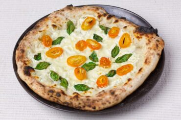 My favourite dessert pizza. Ricotta, fior di latte, caramelised and flambéed kumquats.