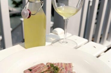 Homemade ravioli filled with my homemade ricotta tossed in a Tuscan herb limoncello sauce, served with a glass of my homemade limoncello