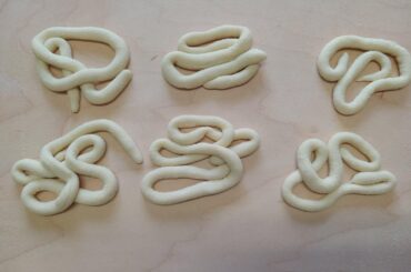 Pici with garlic cream, tomato powder, tomato coulis, and parsley oil (more info in comments)