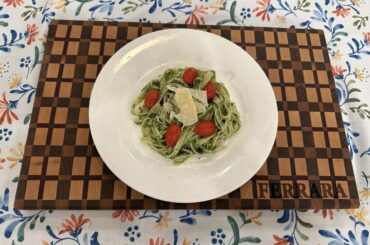 Homemade pesto with homemade fettuccine. Added some fresh shaved parmigiano reggiano and sliced cherry tomatoes to represent the colors of the Italian flag