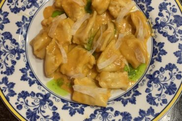 Homemade shrimp agnolotti with bisque, shaved fennel and chive oil