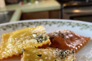 Brown butter cheesy pumpkin ravioli with freshly grated parmesan