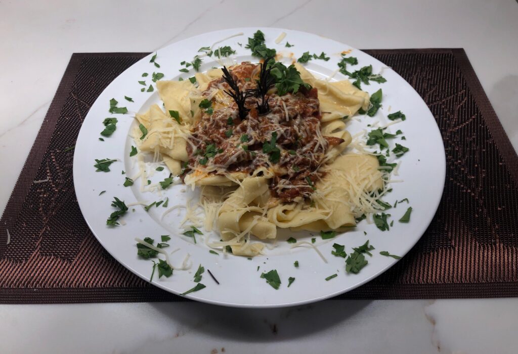 Homemade pappardelle with lamb ragu….
