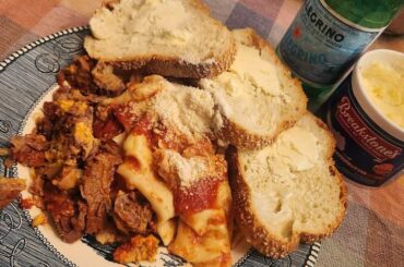 Pasta with beef bracoille (a flank steak pounded thin tied and stuffed with peeled boiled eggs)