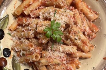 Fresh Ziti pasta with homemade Italian tomato sauce topped with fresh parsley and Parmesan cheese