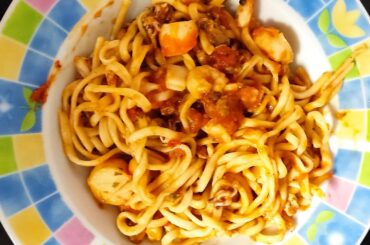 Home made durum linguine in frutti di mare sauce