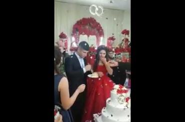Angry groom loses it during wedding cake cutting ceremony, leaving guests and bride horrified