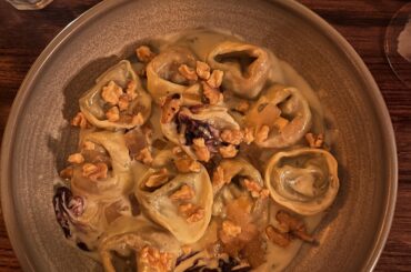 [I ate] Tortelloni sautéed in gorgonzola cream, radicchio, caramelized peaches & crunchy walnuts