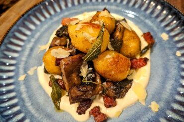 Gnocchi in brown butter and sage sauce, mushrooms, speck, and crème fraîche.