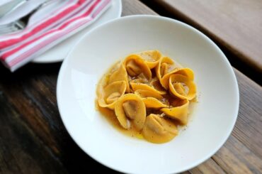 duck (liver) tortellini with chicken consomme brodo and roasted cabbage