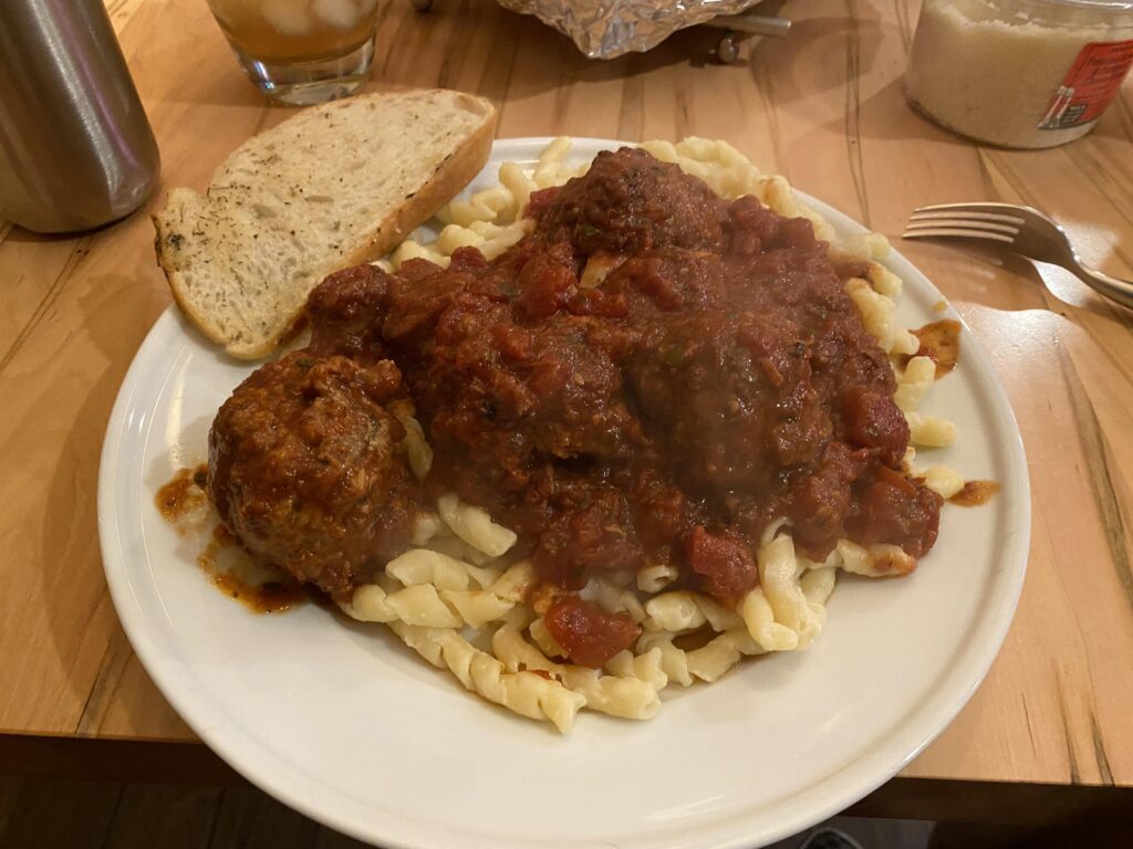 For whatever reason, Christmas Eve has become pasta for us. (I made and ate) slow simmered marinara sauce with roasted garlic, hot Italian sausage and homemade meatballs. Garlic bread with herbs, butter, and more roasted garlic.