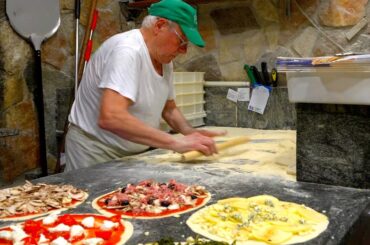 For 60 years! Roman Pizza Master baking more than 300 Wood-fired oven pizzas every day!