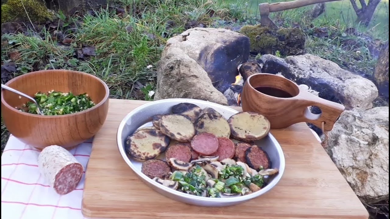 Bushcraft: grilled typical “Cacciatore” salami, potatoes, red wine and mushrooms with green sauce. Bushcraft: grilled typical "Cacciatore" salami, potatoes, red wine and mushrooms with green sauce.