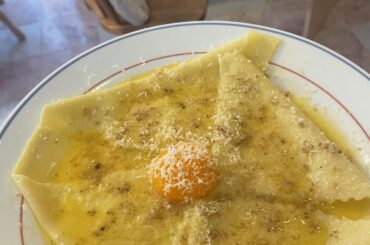 Fresh silk handkerchief pasta in beurre blanc with confit egg yolk and walnuts