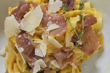 Fettuccine with a thyme infused brown butter and butternut squash sauce topped with crispy prosciutto