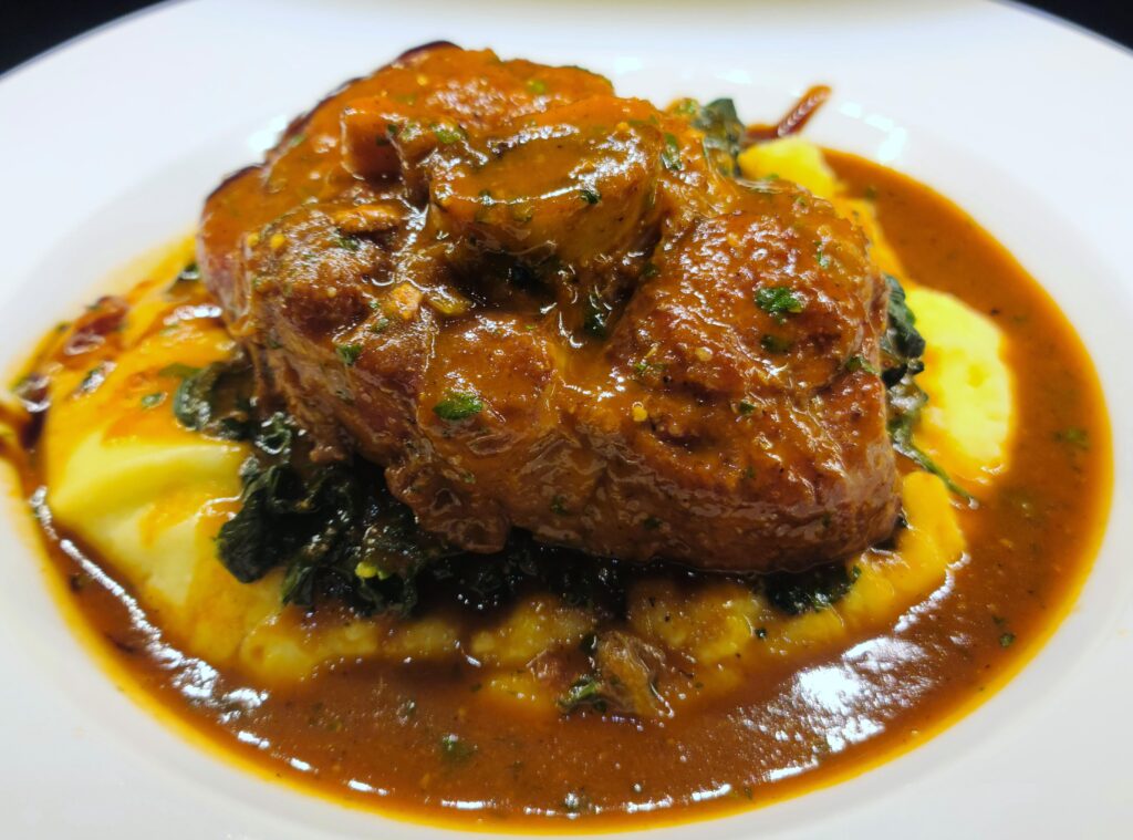 Osso Bucco With Spinach, on top of Tallegio-Saffron Whipped Potatoes