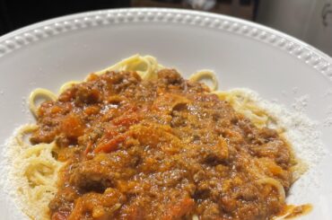 My four-hour meat sauce with spaghetti and parmigiana reggiano