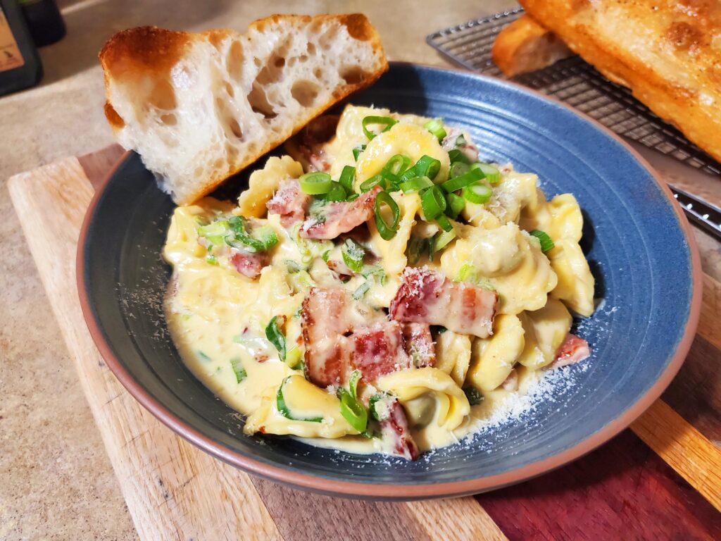 Beef tortellini in bacon cream sauce with green onions