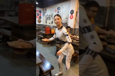 A Realistic Chinese Robot Waiter Enhances Dining Experience in a Chongqing Hotpot Restaurant