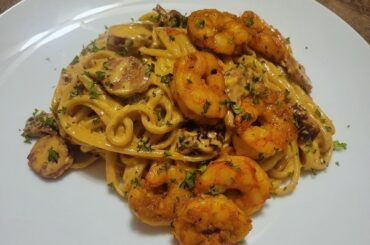 Creamy cajun trenette pasta with spicy andouille sausage and wild patagonian red shrimp.