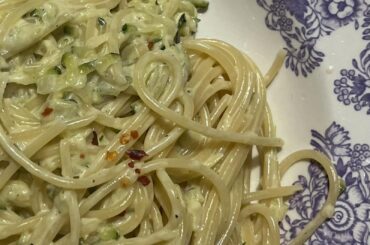 Creamy pasta with courgettes, creme fraiche, cream, chili flakes and Parmigiano
