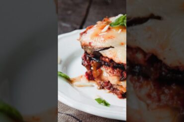 Melanzane alla Parmigiana, a classic Italian dish made with fried eggplant, tomato sauce, and cheese