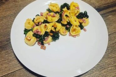 Cheese filled Tortellini with Pancetta, Kale, and Garlic crisps.