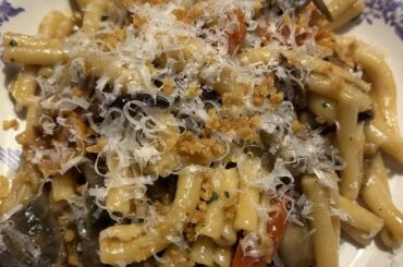 Strozzapreti with fried aubergines, mushrooms and sweet cherry tomatos