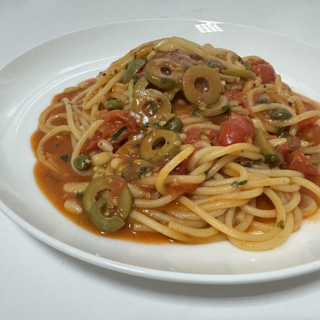 My third attempt on spaghetti with anchovy, caper, cherry tomato, pine nut, garlic, and green olives.