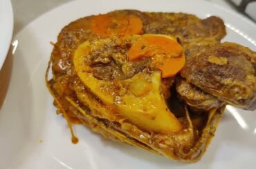 Osso Buco (beef with bone) with gremolata - Italian dish