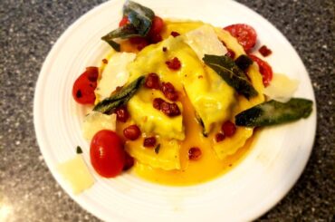 First time making Raviolo al' Uovo, it turned out pretty good. Served with sage butter, topped with crispy pancetta, fried sage leaf, parmigiano shavings and marinated cherry tomatoes.
