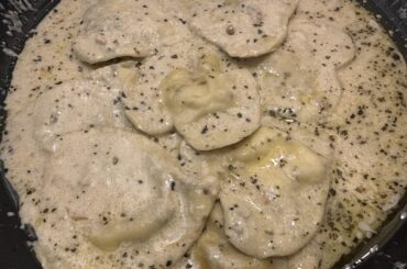 Homemade ravioli and Alfredo sauce