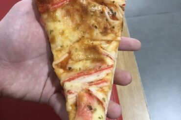 Just a slice of cheesy shrimp pizza