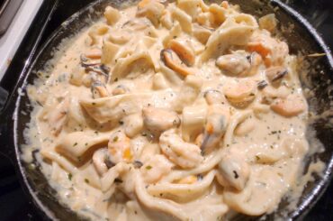 homemade, hand-rolled gluten-free pasta, with homemade creamy alfredo, topped w/ baby shrimp & mussels. My partner prefers the thicker pasta! Would love feedback!
