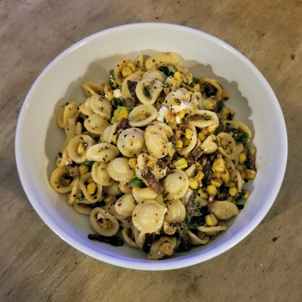Orrechiette with Pepper Bacon, Corn, Leeks, Jalapenos, Lime, and Queso Fresco