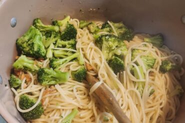Spaghetti with garlic and brocolli fried in olive oil w fresh ricotta, ricotta salata, and parmegianno regianno mangia!!!!