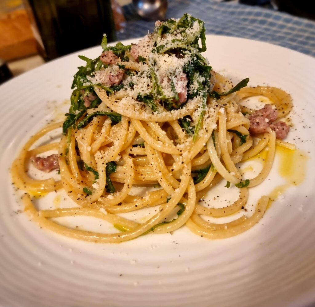 Bucatini with sausage, rocket and lemon