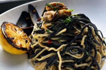 Squid ink pasta with ‘Nduja and mussels