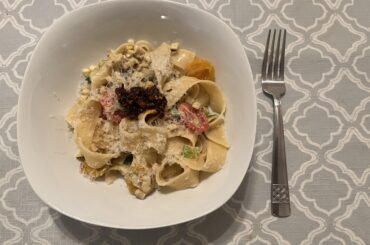 Tagliatelle in a charred corn, scallion and tomato sauce