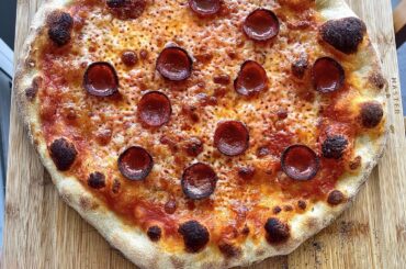 My most recent pizza and my first one. 5 months of pizza progress.