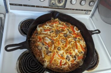 Broke in my seasoned Castiron pan with a pan pizza.
