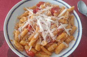 Homemade Gnocchetti sardi with cherry tomatoes, extra virgin olive oil, shallots, chilli pepper, paprika, salt and parmesan