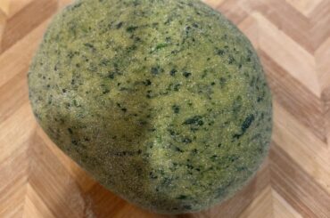 Homemade Semolina Spinach Pasta with Roasted Garlic and Parmesan.