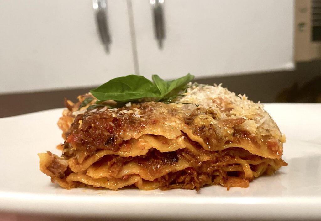 Lasagna made with braised beef ragu, bechamel, and fresh pasta.