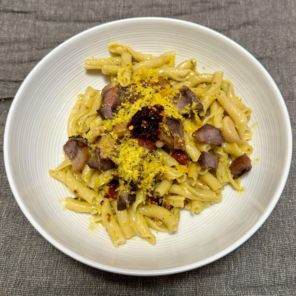 Pesto carbonara with confit garlic, chili crisp cured egg yolks, and leftover dry aged picanha [OC]