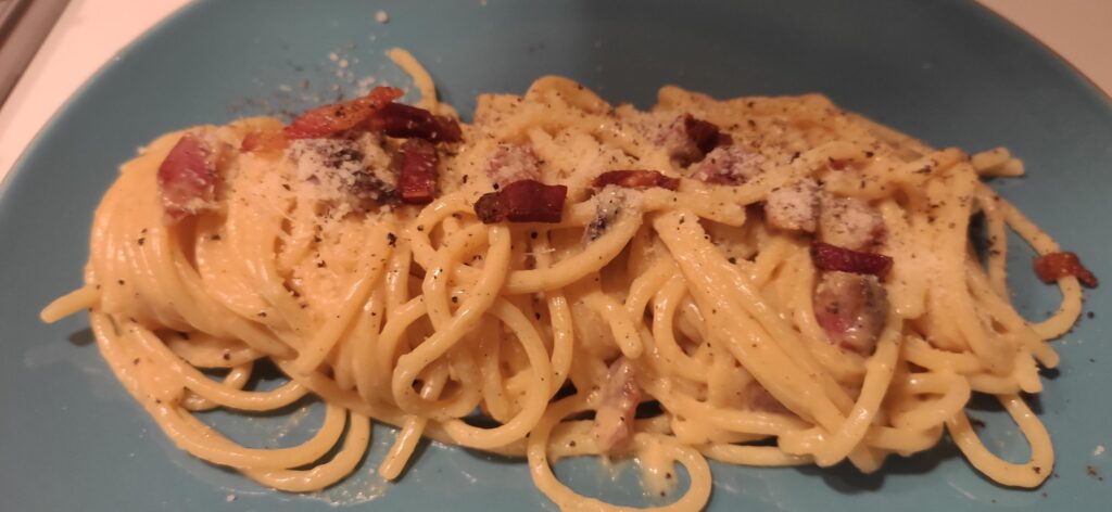 Here she goes ...   sardinian guanciale (because that's what I had and was a gift), 75% pecorino, 25% parmigiano, spaghettone, acqua di cottura. Added crunchy guanciale as topping.   I liked it