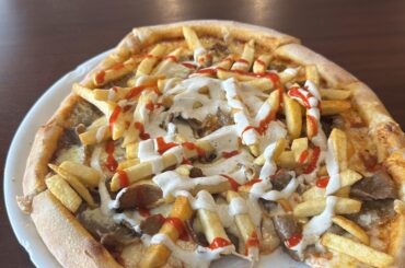 Pizza in Sweden. Not my food, but I'm sorry for the Italian trauma I'm about to bring.