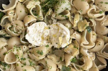 Lumaconi with artichokes, capers, garlic, lemon, basil, parsley and burrata. Topped with pangrattato.